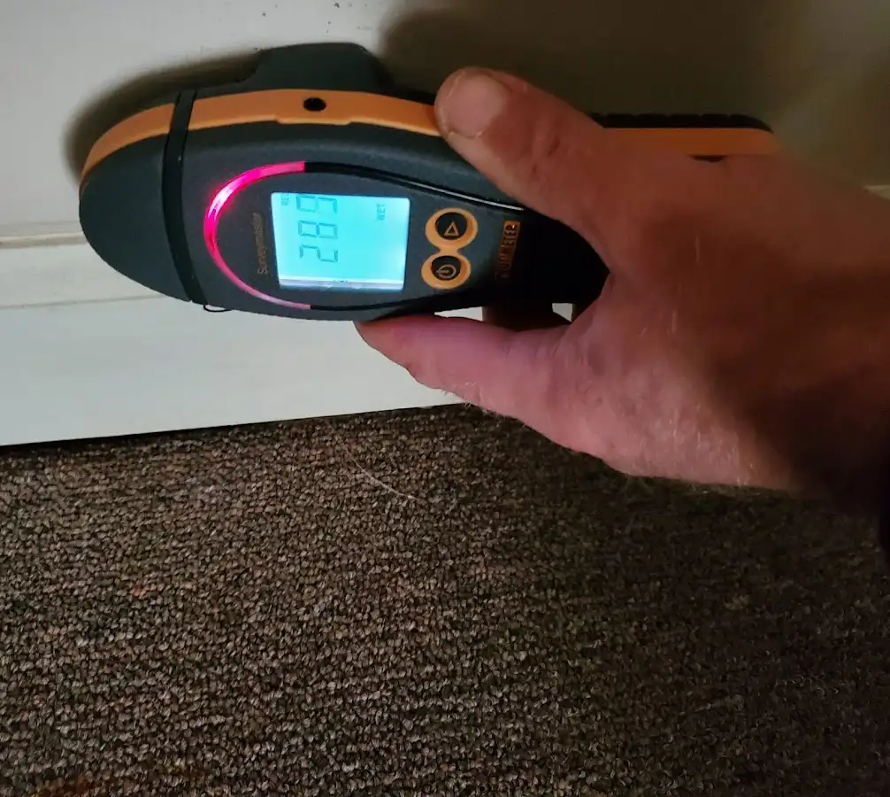 Moisture detection at baseboard during Storm Damage Restoration in Corinth